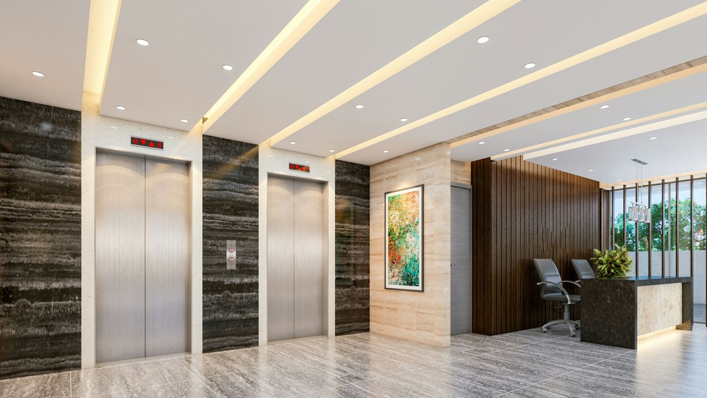Modern building lobby with steel lift doors and reception desk