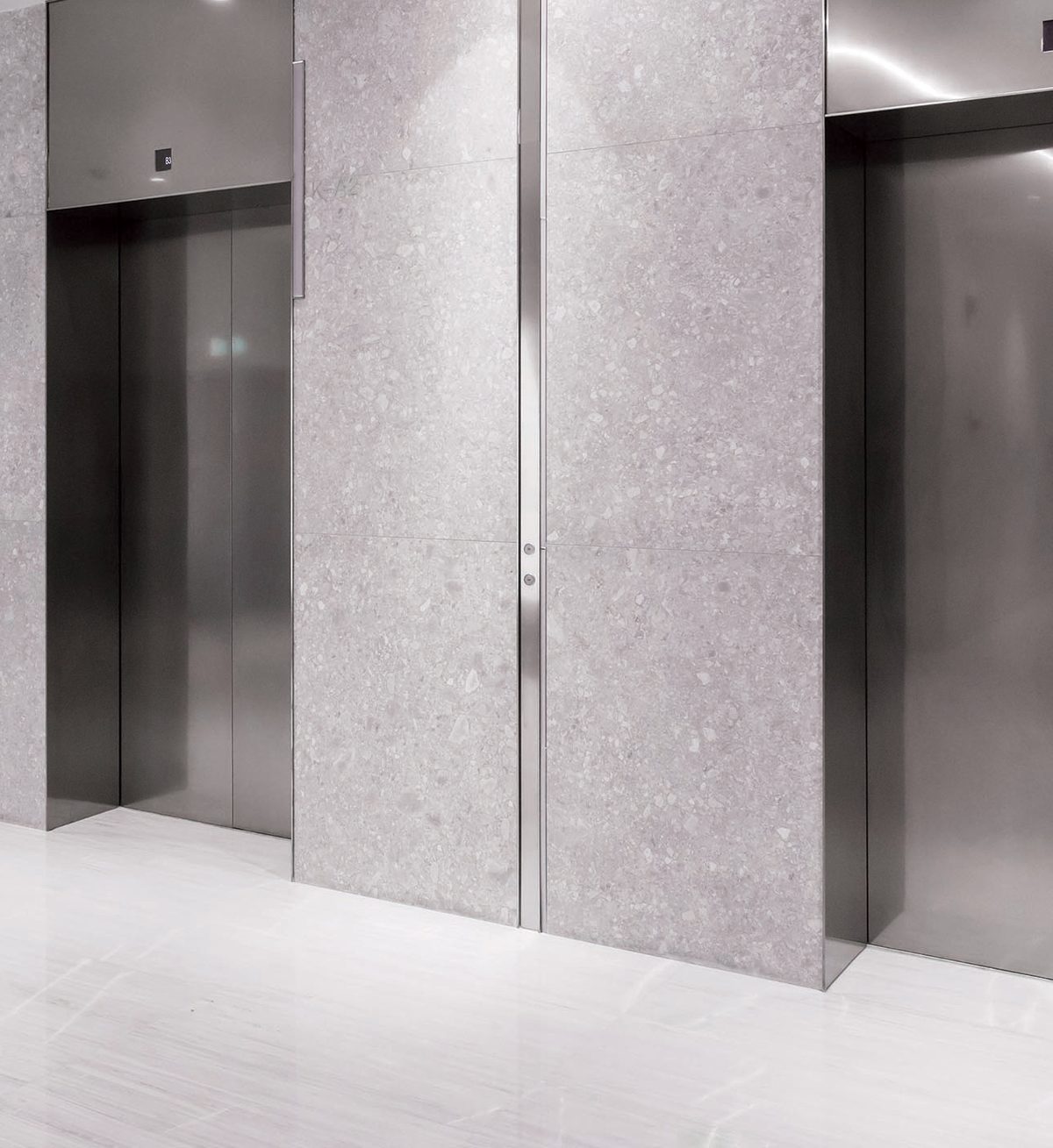 Modern lobby with stainless-steel elevator doors